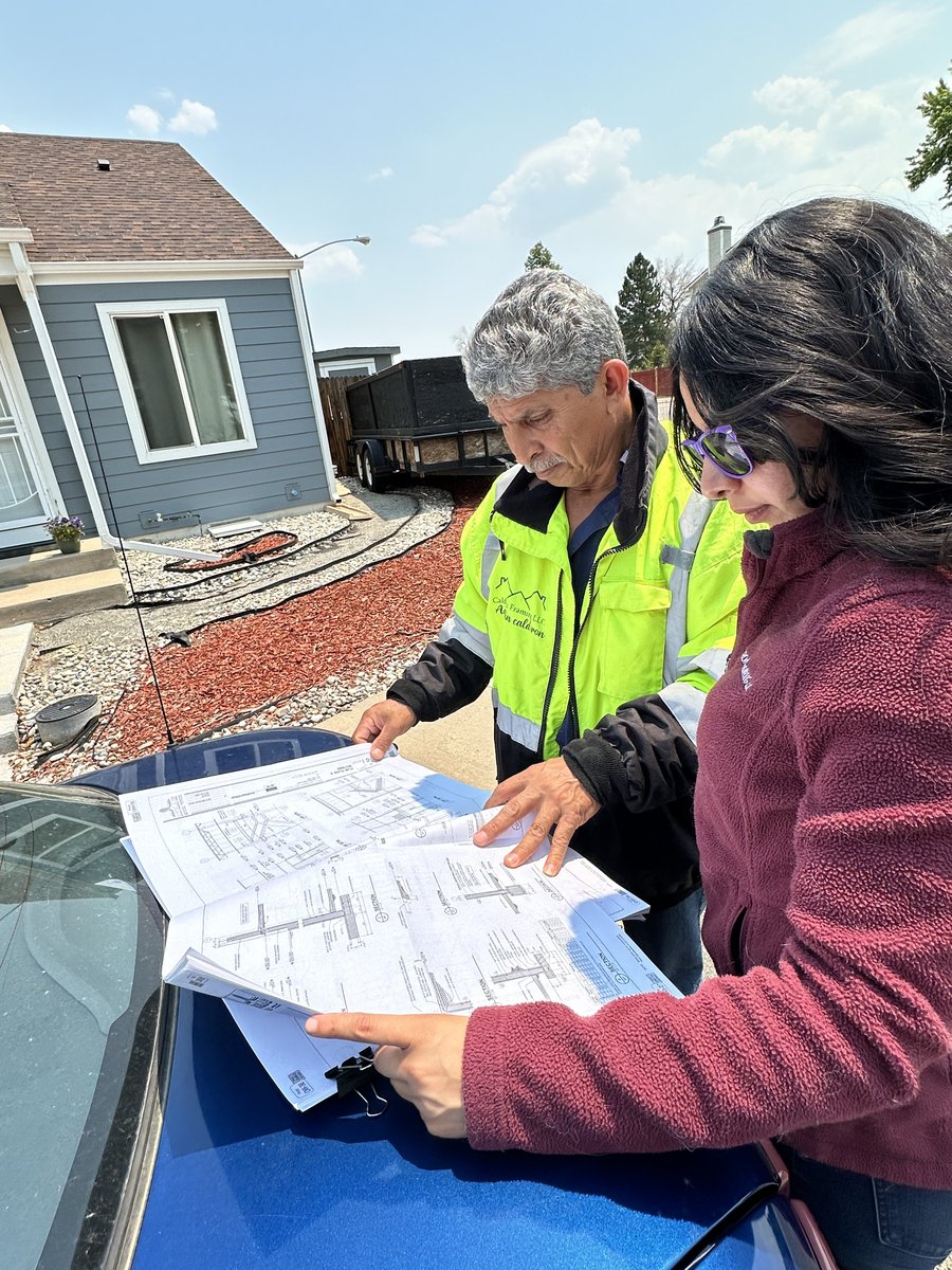 Calderon Framing team members reviewing blueprints on a job site